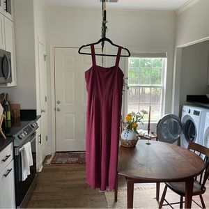 maroon jumpsuit with black and white detail